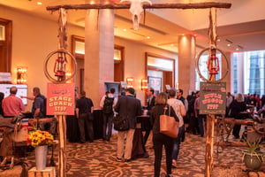 group of attendees walking around expo hall at a user conference