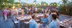 group of event attendees networking during a dinner