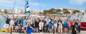 group of event attendees smiling during an inventive trip