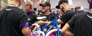 group of event attendees building a bike