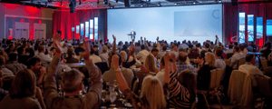 event attendees watching a presentation during a corporate conference 