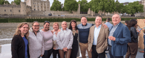 event attendees smiling for a photo in England during an incentive trip