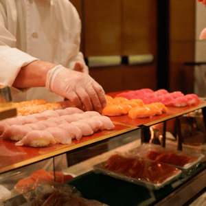 sushi chef creating nigiri for a conference event venue