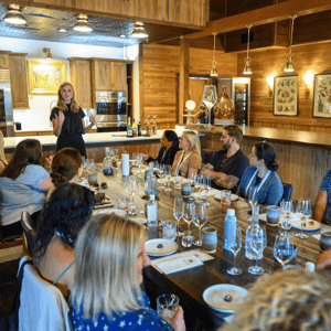 group of event attendees wine tasting in Napa