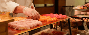 chef preparing sushi for a corporate event dinner