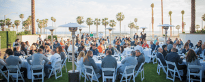 group of event attendees enjoying dinner during a leadership sales summit