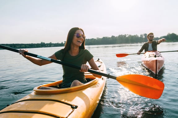 two people enjoying the benefits of incentive travel on kayaks
