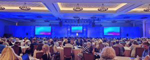 group of attendees watching a presentation during a conference in las vegas