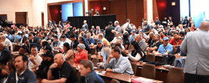 group of event attendees watching a corporate conference