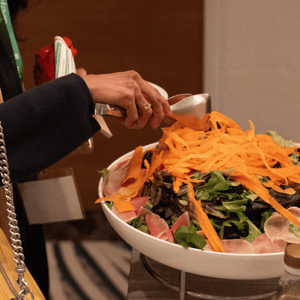 event attendee eating a salad for lunch