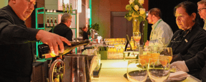 bartender pouring corporate event attendees drinks