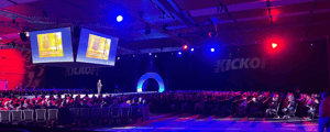 CEO giving a presentation at a corporate conference on stage