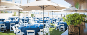 white chairs and blue tables at an event